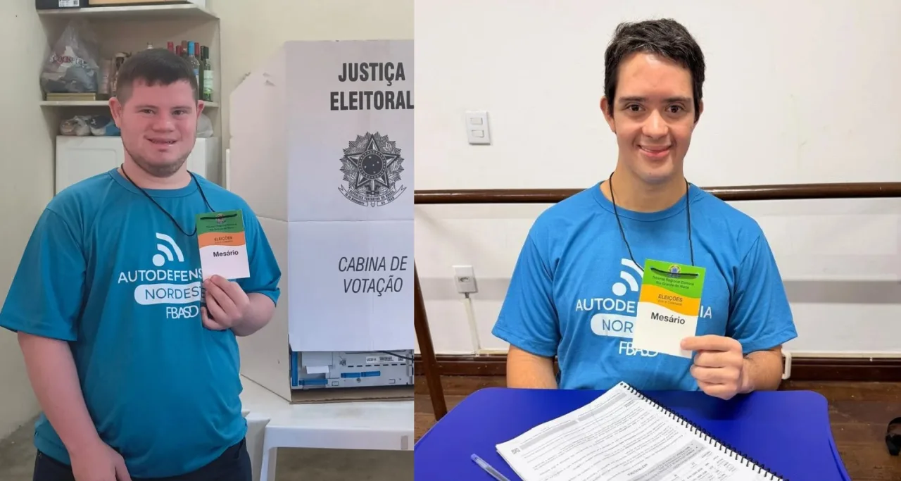 Dois jovens com síndrome de Down trabalhando como mesários em seção eleitoral.